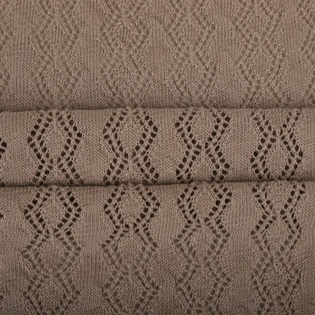 brown color yarn knitting swatch in diamond knitting pattern, yarn for knitting sweater, recycled polyester yarn, ring spun yarn, buy yarn in wholesale price.