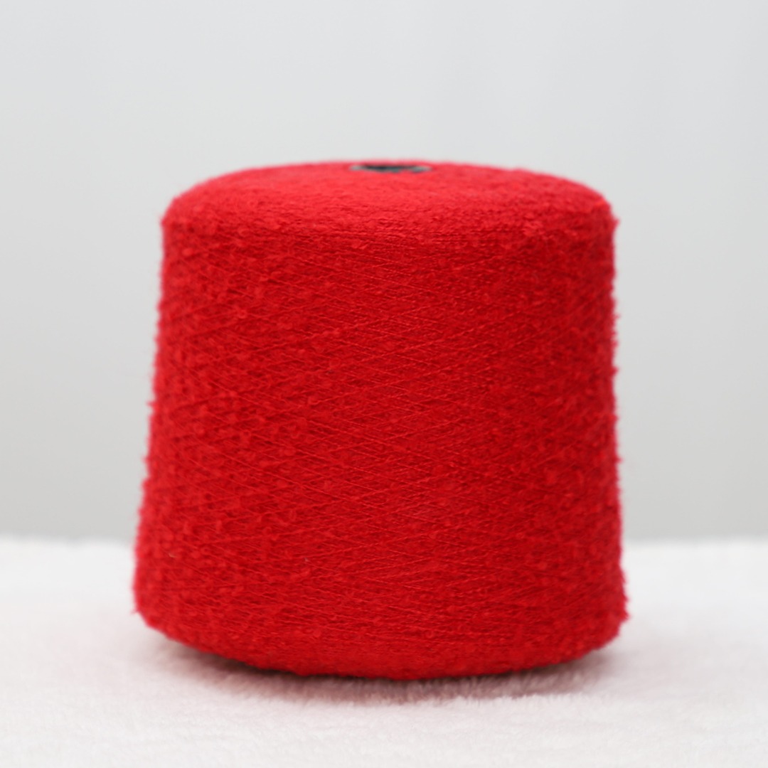 red yarn cone in white background, China yarn in 1/9s Nm yarn count, yarn for knitting sweater, fancy yarn, boucle yarn, acrylic yarn, wholesale price yarn, discount price yarn, red fancy yarn cone.