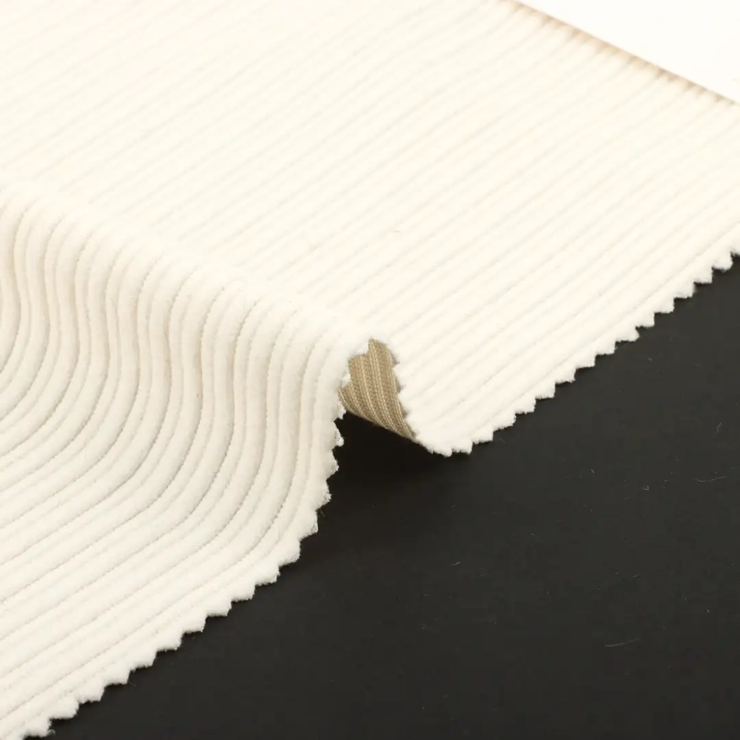 China Fabric for Pants,Jackets,Overcoat knitted Corduroy Knit Fabric Polyester cream color buy from China wholesaler bulk order at wholesale price free worldwide shipping Alibaba